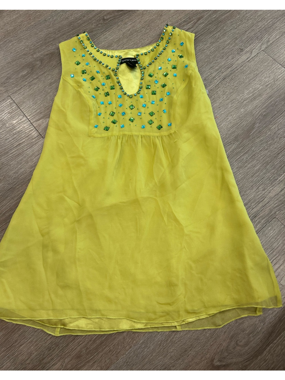 Women's green silk garment top with beading
